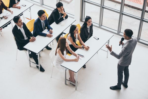 Businessman is explaining works to officers while training together at the office.